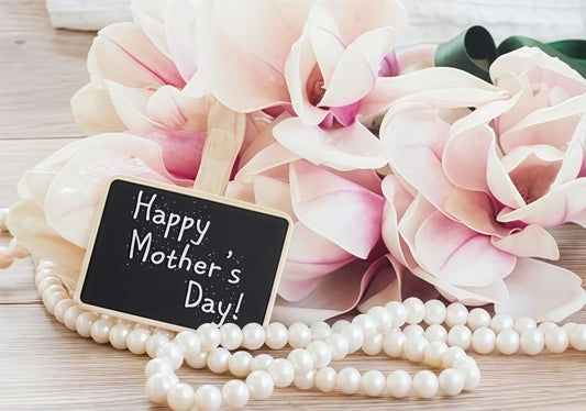 Mother's Day pearl necklace gift ideas featuring pearls next to pink flowers and a Happy Mother's Day sign