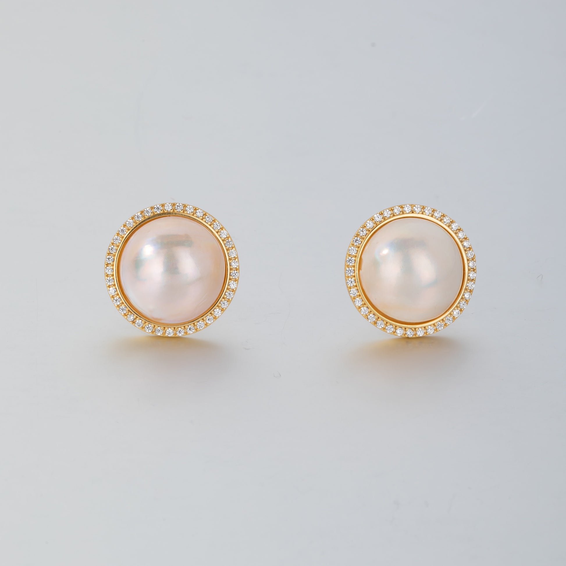 STELLA MARGARITA mabe pearl diamond rim earrings with gold setting and round pearl center