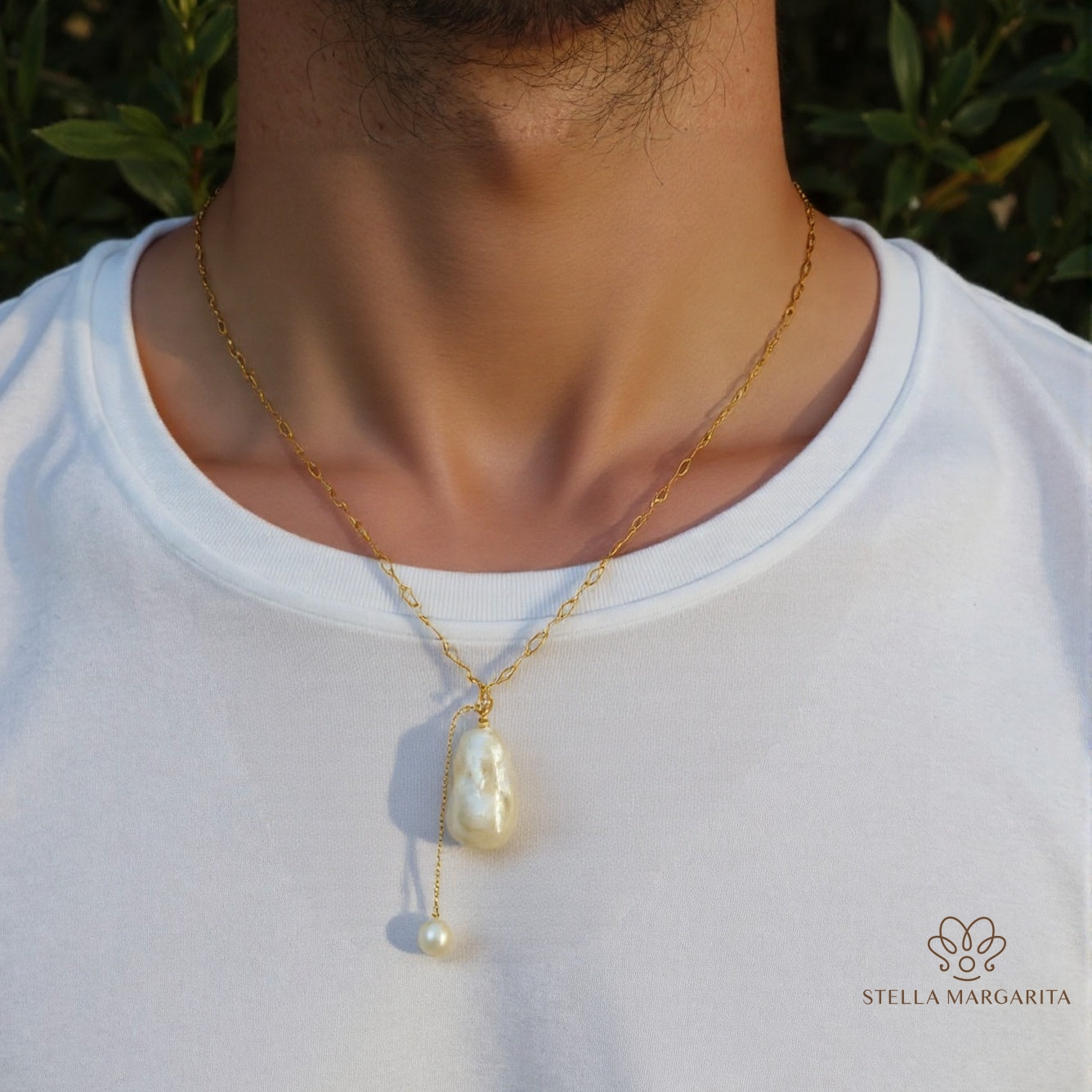STELLA MARGARITA handcrafted pearl pendant necklace with gold chain worn on a man in white shirt