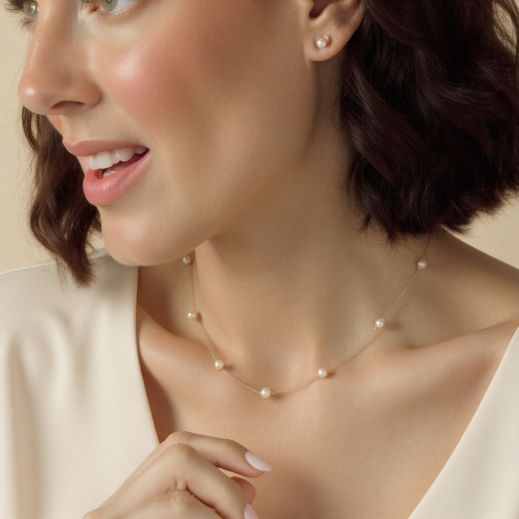 STELLA MARGARITA sterling silver freshwater pearl necklace worn by woman with short brown hair