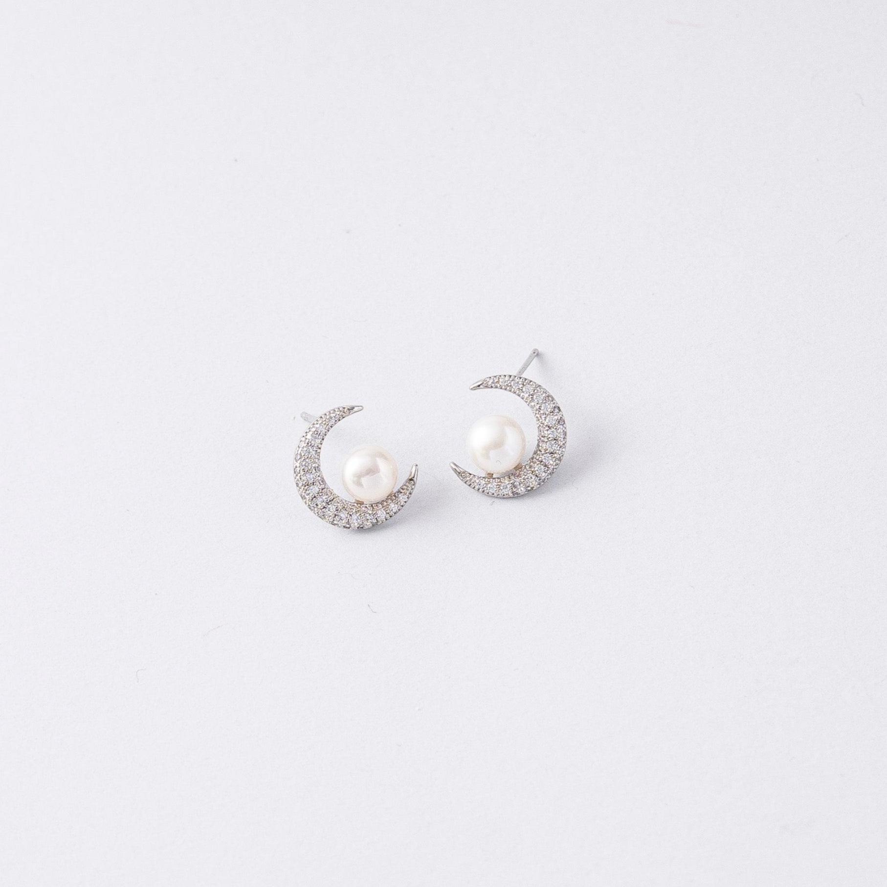 STELLA MARGARITA celestial moon pearl earrings featuring crescent shapes with pearls and sparkling stones