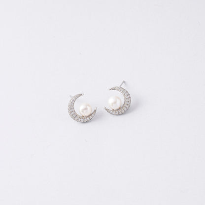 STELLA MARGARITA celestial moon pearl earrings featuring crescent shapes with pearls and sparkling stones