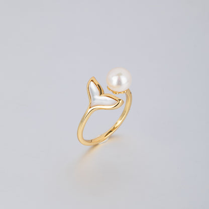 18K gold pearl mermaid ring featuring a gold band with a mermaid tail and a white pearl
