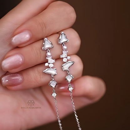 Stella Margarita earrings featuring Arctic glacier inspired jewelry design with silver and white gemstone accents