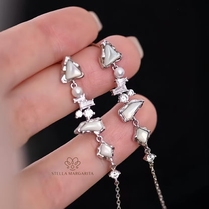 STELLA MARGARITA earrings featuring pearl and crystal details inspired by Arctic glacier inspired jewelry