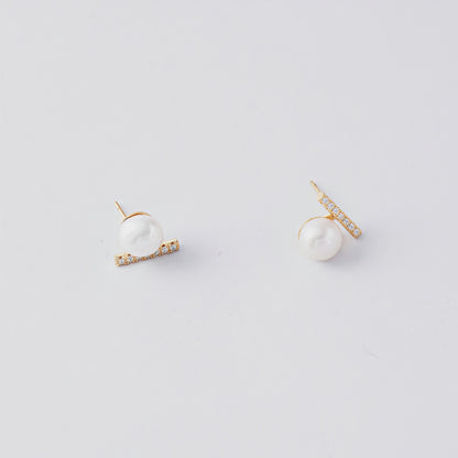 STELLA MARGARITA balance beam pearl stud earrings with gold and small crystals on white background