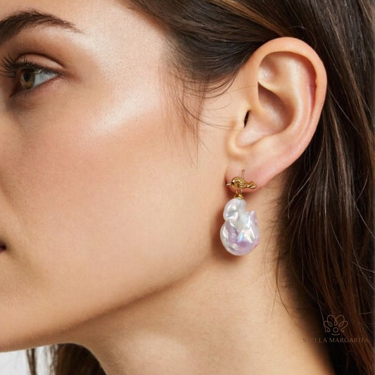 STELLA MARGARITA baroque freshwater pearl earrings with gold-tone posts worn on ear