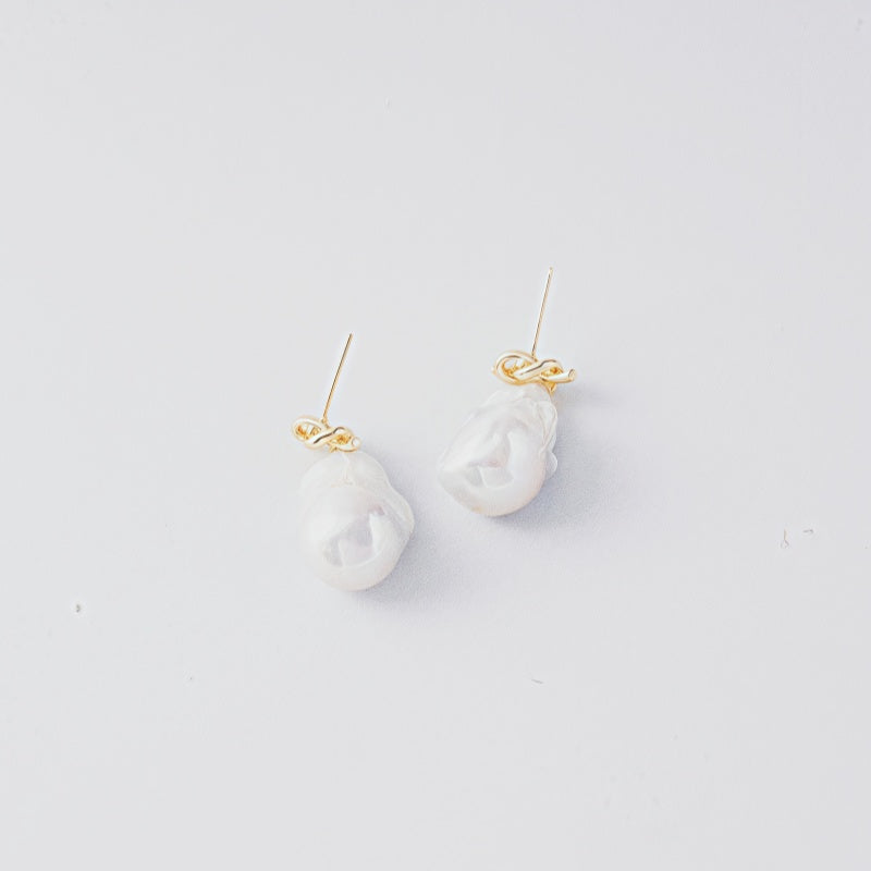STELLA MARGARITA baroque freshwater pearl earrings with gold accents on white background