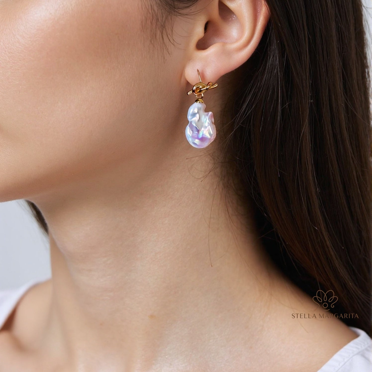 STELLA MARGARITA baroque freshwater pearl earrings with gold hooks worn on ear