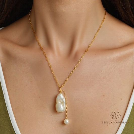 STELLA MARGARITA handcrafted pearl pendant necklace with gold chain on model's neck