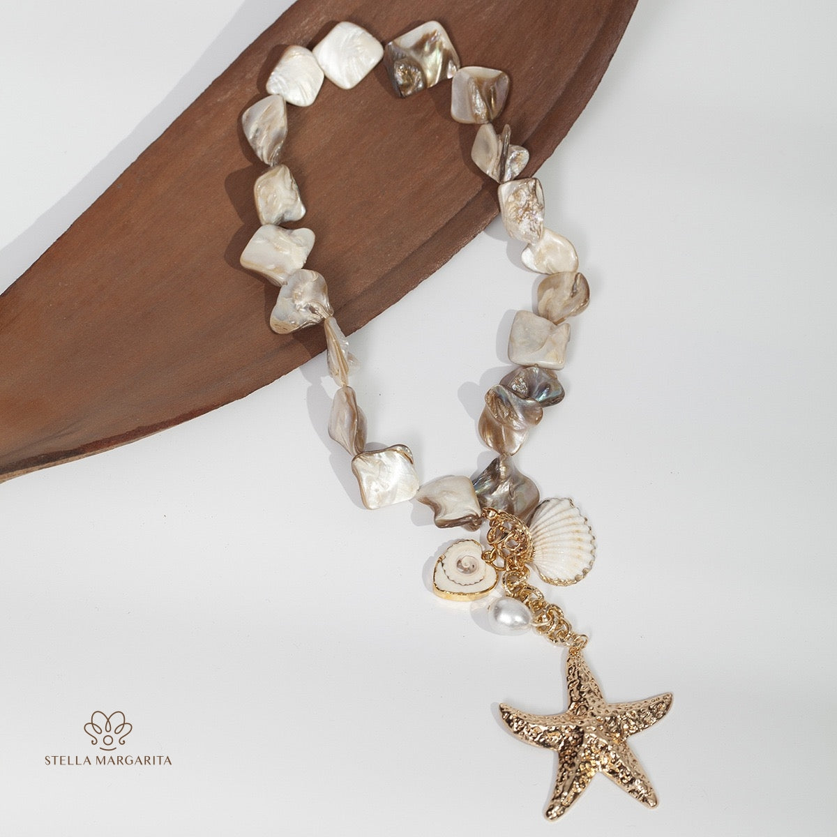 STELLA MARGARITA mother of pearl starfish necklace with gold starfish charm and shell accents