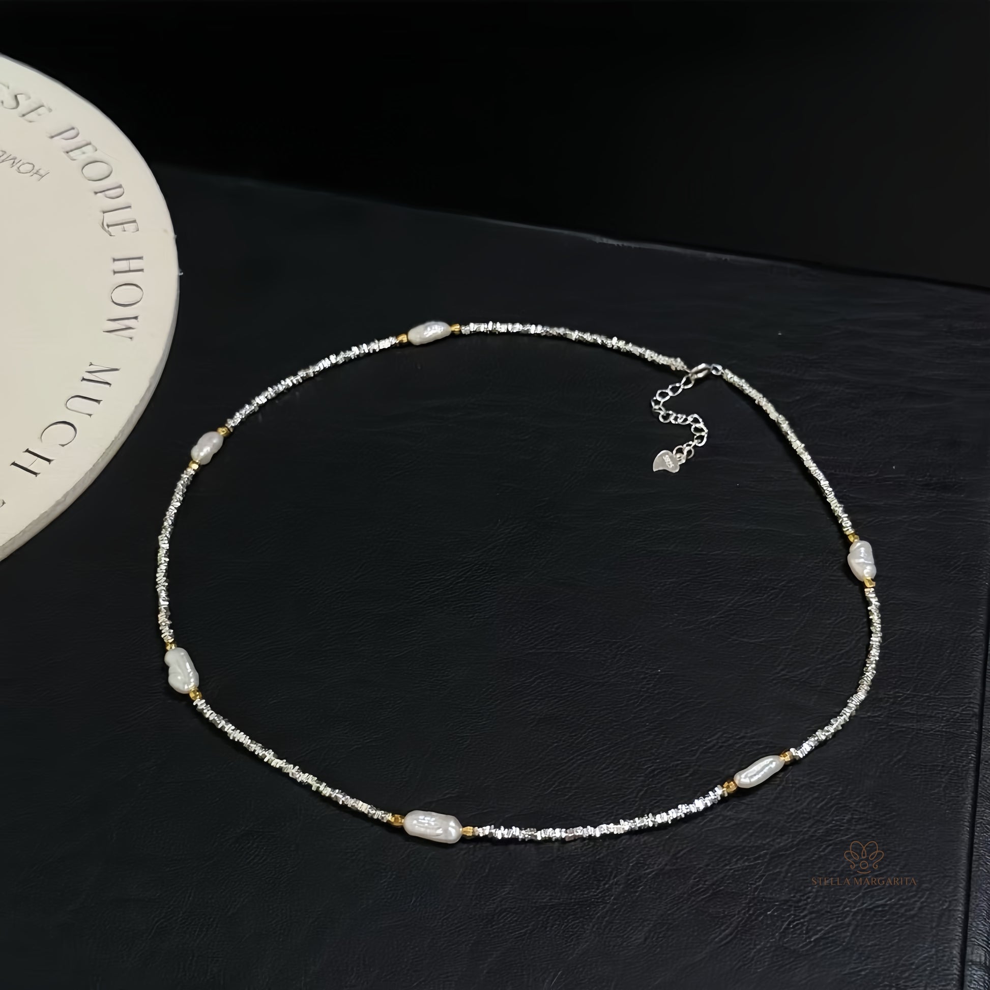 STELLA MARGARITA sterling silver baroque pearl choker necklace with irregular pearls on black background