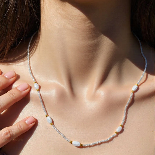 STELLA MARGARITA sterling silver baroque pearl choker necklace with small gold accents worn on neck