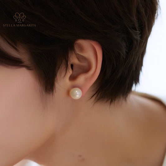 STELLA MARGARITA white pearl earrings for women worn on ear with short hair background